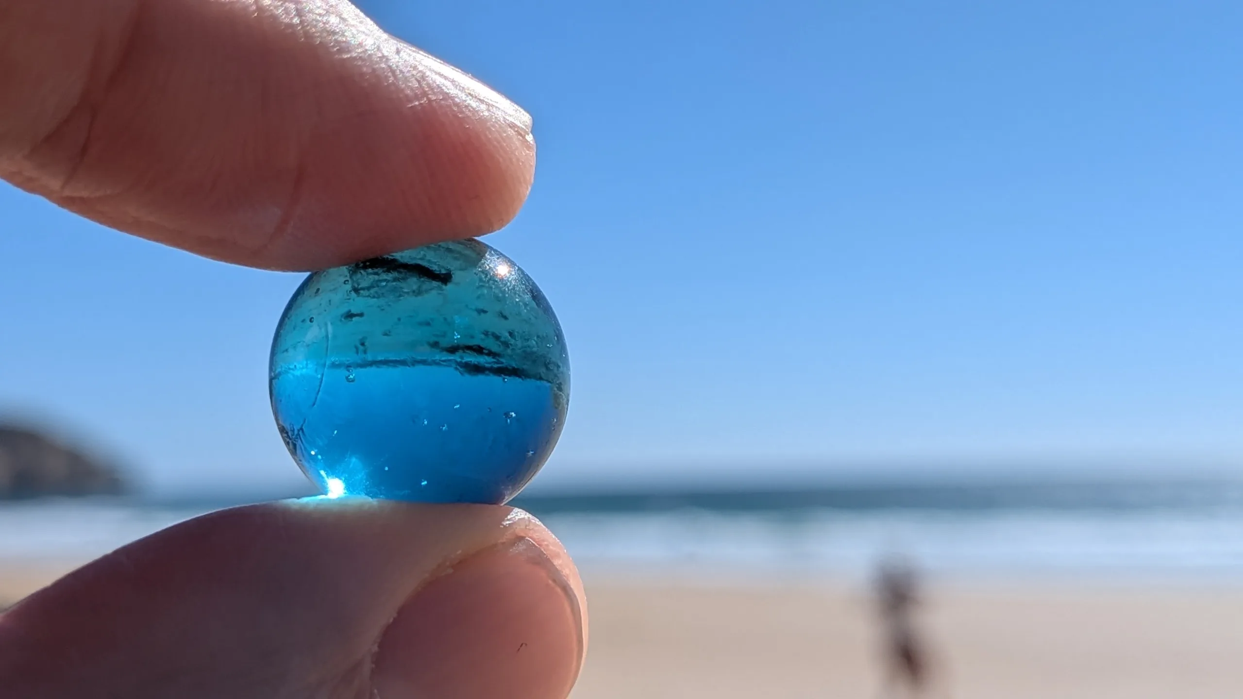 James Wittering holding a blue marble, a Blue Health attention exercise
