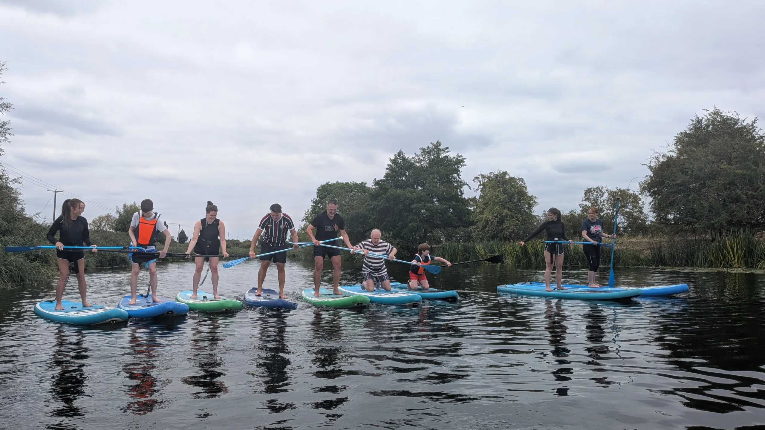 Team paddleboarding on the River Avon